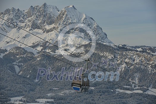 Ski lift gondola in Alps mountains at winter