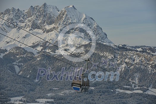 Ski lift gondola in Alps mountains at winter Ski lift gondola in Alps mountains at winter