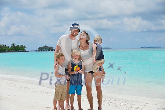 Portrait of a happy family on summer vacation  at beach