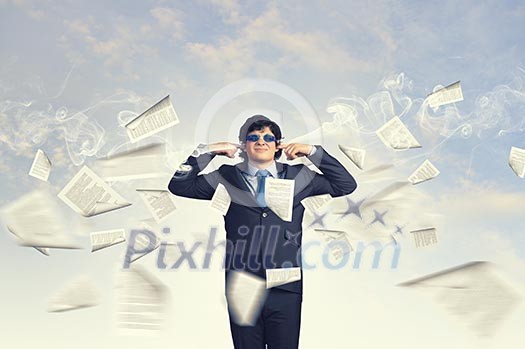 Image of businessman stopping his ears. Long working hours Image of businessman stopping his ears. Long working hours