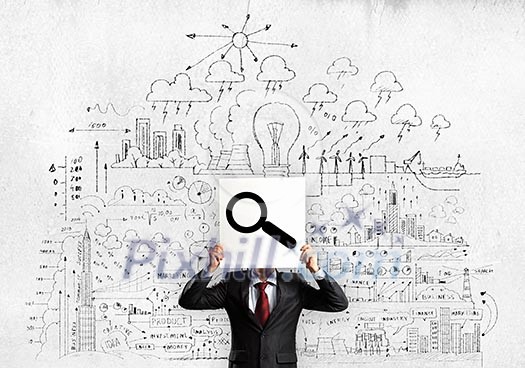Businessman hiding his face with sheet of paper with sketches at background Businessman hiding his face with sheet of paper with sketches at background