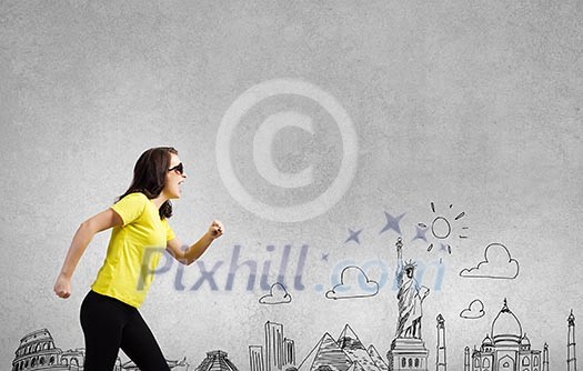 Young woman in yellow shirt against sketch background