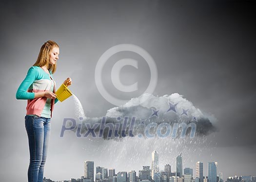 Young woman in casual pouring water on city Young woman in casual pouring water on city