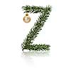 Letter Z made from fir branches, decorated with christmas balls and reflection.