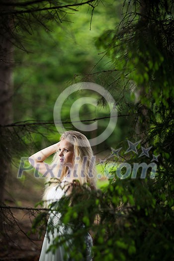 Lovely bride outdoors in a forest Lovely bride outdoors in a forest