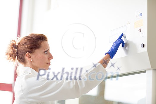 Portrait of a female researcher doing research in a lab (shallow DOF; color toned image) Portrait of a female researcher doing research in a lab (shallow DOF; color toned image)