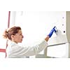 Portrait of a female researcher doing research in a lab (shallow DOF; color toned image)