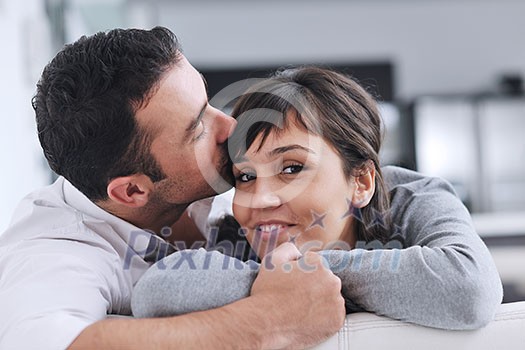 happy young couple relax at modern home living room indoor happy young couple relax at modern home living room indoor