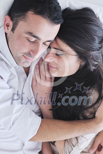 happy young couple relax at modern home living room indoor happy young couple relax at modern home living room indoor