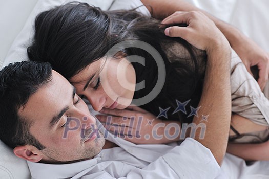 happy young couple relax at modern home living room indoor happy young couple relax at modern home living room indoor