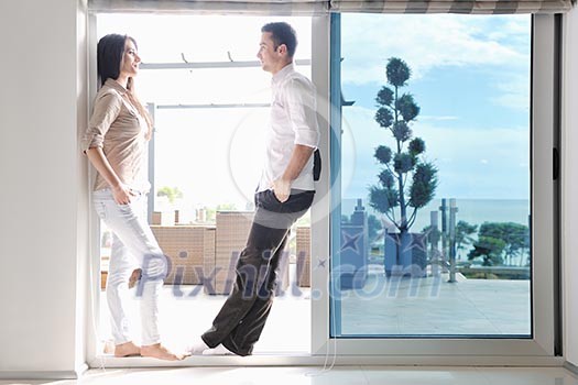 happy young couple relax at modern home living room indoor happy young couple relax at modern home living room indoor