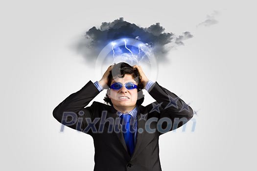 Image of depressed businessman tearing his hair