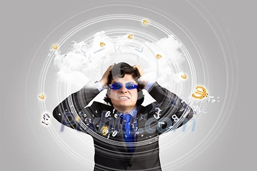 Image of depressed businessman tearing his hair Image of depressed businessman tearing his hair