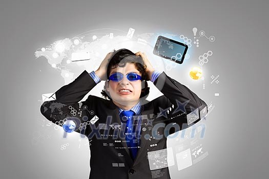 Image of depressed businessman tearing his hair Image of depressed businessman tearing his hair