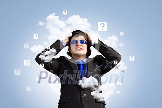 Image of depressed businessman tearing his hair Image of depressed businessman tearing his hair
