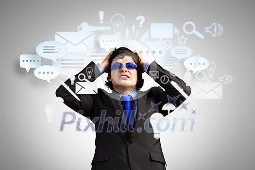 Image of depressed businessman tearing his hair