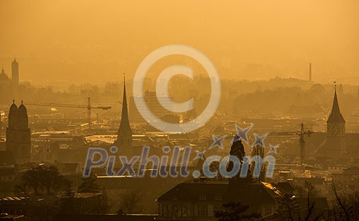 View of Zurich from above - misty winter evening and smoke