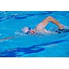 group of happy kids children   at swimming pool class  learning to swim