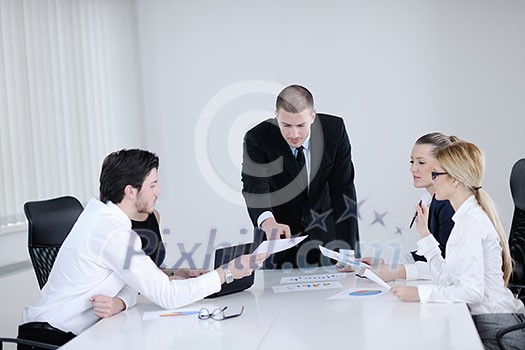 Group of happy young business people in a meeting at office Group of happy young business people in a meeting at office
