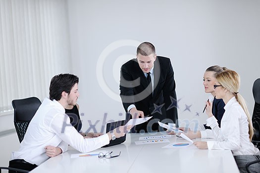 Group of happy young  business people in a meeting at office