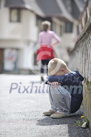 sad and unhappy alone child cry and have emotion problem on street