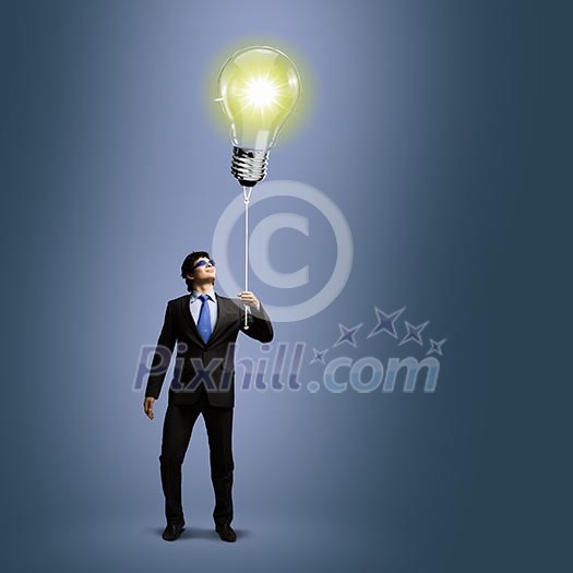 Image of businessman with bulb balloon. Inspiration concept Image of businessman with bulb balloon. Inspiration concept