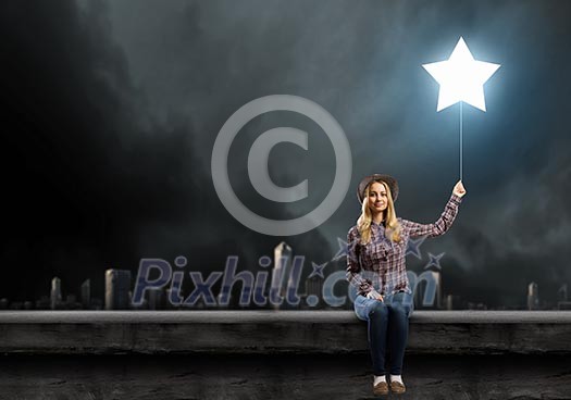 Young woman in casual with balloon shaped like star