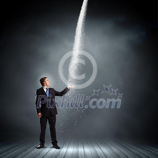 Young businessman under raining sky. Failure concept Young businessman under raining sky. Failure concept