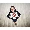 Top view of businesswoman holding banner with prohibition sign
