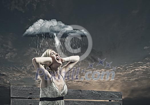 Young woman sitting on bench closing ears with palms and screaming Young woman sitting on bench closing ears with palms and screaming