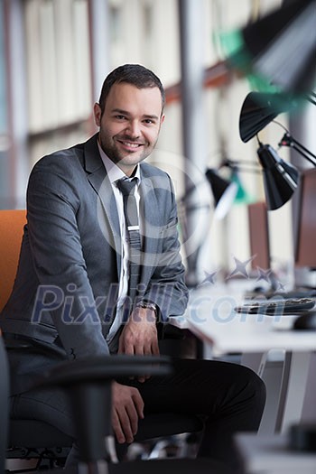 happy young business man portrait in bright modern office indoor