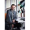 happy young business man portrait in bright modern office indoor