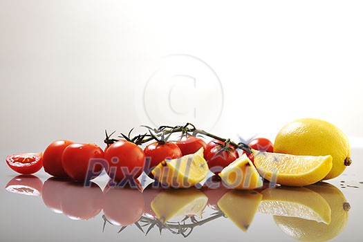 fresh lemon and tomato fruit isolated on white 