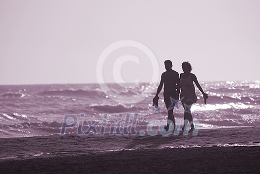 romantic couple walking on beach