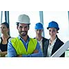 business people group on meeting and presentation  in bright modern office with construction engineer architect and worker looking building model and blueprint planbleprint plans