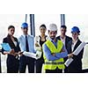 business people group on meeting and presentation  in bright modern office with construction engineer architect and worker looking building model and blueprint planbleprint plans