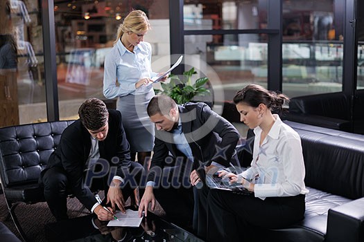 Group of happy young  business people in a meeting at office