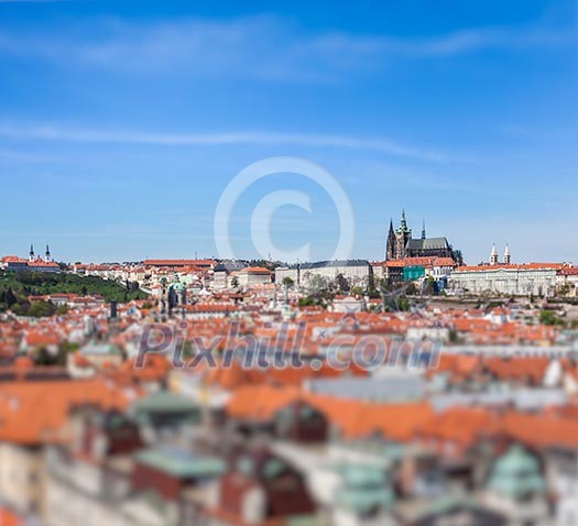 View of Stare Mesto Old City and St. Vitus Cathedral from Town Hall with tilt shift toy effect shallow depth of field. Prague, Czech Republic