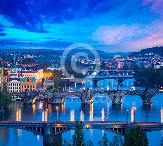 Travel Prague concept background - elevated view of bridges over Vltava river from Letna Park. Prague, Czech Republic in twilight