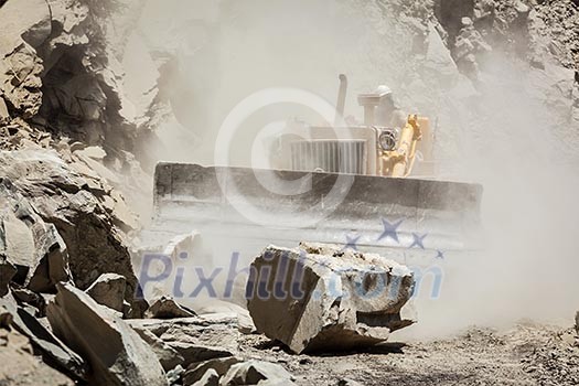 Bulldozer cleaning landslide from road in Himalayas. Himachal Pradesh, India Bulldozer cleaning landslide from road in Himalayas. Himachal Pradesh, India