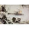 Bulldozer cleaning landslide from road in Himalayas. Himachal Pradesh, India