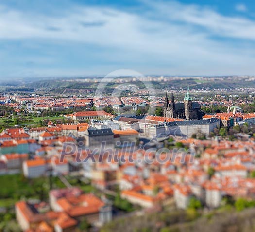 Aerial view of Hradchany part of Prague - the Saint Vitus St. Vitt's Cathedral and Prague Castle, view from Petrin Observation Tower with tilt shift toy effect shallow depth of field. Prague, Czech Republic