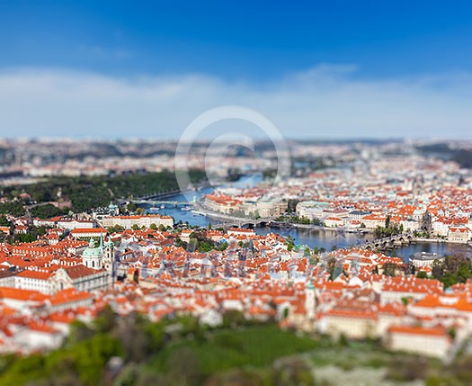 Aerial view of Charles Bridge over Vltava river and Old city from Petrin hill Observation Tower with tilt shift toy effect shallow depth of field. Prague, Czech Republic Aerial view of Charles Bridge over Vltava river and Old city from Petrin hill Observation Tower with tilt shift toy effect shallow depth of field. Prague, Czech Republic