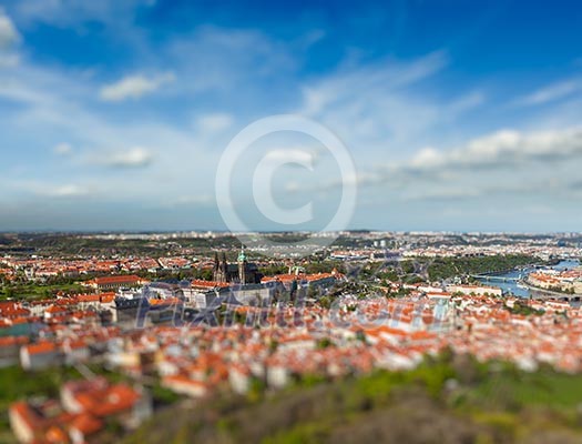 Aerial view of Hradchany part of Prague - the Saint Vitus St. Vitt's Cathedral and Prague Castle, view from Petrin Observation Tower with tilt shift toy effect shallow depth of field. Prague, Czech Republic Aerial view of Hradchany part of Prague - the Saint Vitus St. Vitt's Cathedral and Prague Castle, view from Petrin Observation Tower with tilt shift toy effect shallow depth of field. Prague, Czech Republic