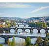 Travel Prague concept background - elevated view of bridges over Vltava river from Letna Park with tilt shift toy effect shallow depth of field. Prague, Czech Republic