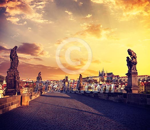 Vintage retro effect filtered hipster style travel image of Charles bridge and Prague castle in the early morning on surise. Prague, Czech Republic