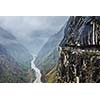 Car on road in Himalayas mountains above precipice