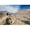 Photographer taking photos in Himalayas mountains. Spiti valley, Himachal Pradesh, India