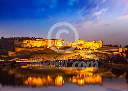 Amer Fort Amber Fort illuminated at night - one of principal attractions in Jaipur, Rajastan, India refelcting in Maota lake in twilight