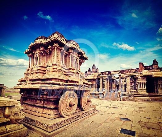 Vintage retro effect filtered hipster style travel image of tourist attraction landmark - Stone chariot in Vittala temple. Hampi, Karnataka, India Vintage retro effect filtered hipster style travel image of tourist attraction landmark - Stone chariot in Vittala temple. Hampi, Karnataka, India